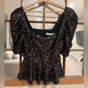 Amanda Uprichard- small. Peplum fit, gathered sleeves. Somewhat cropped.